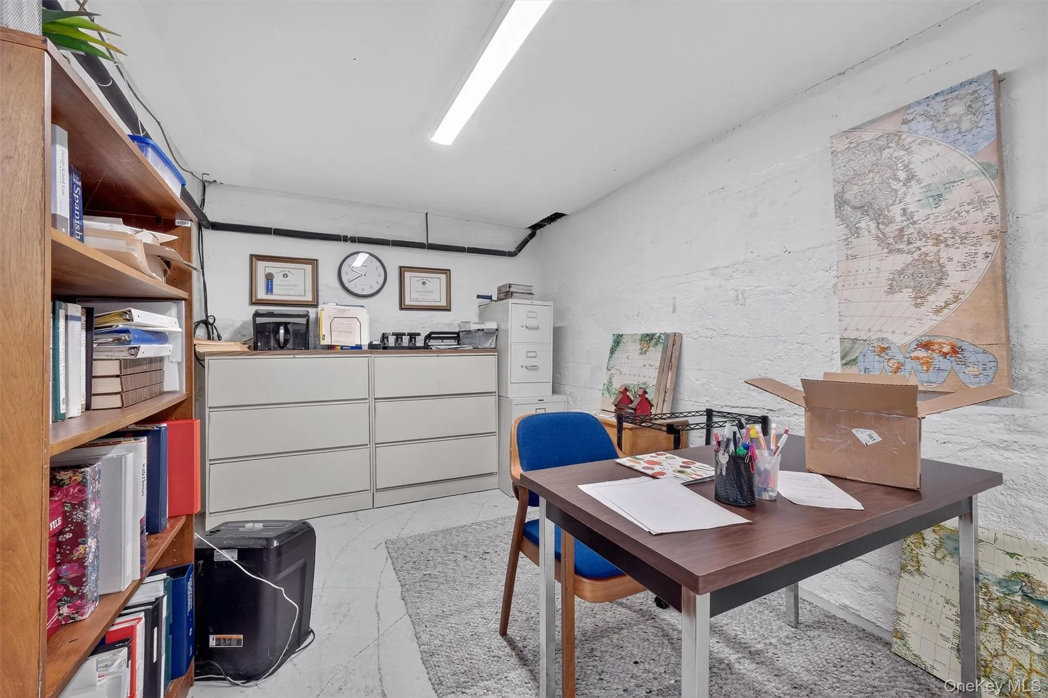 Office featuring light marble finish flooring Office featuring light marble finish flooring