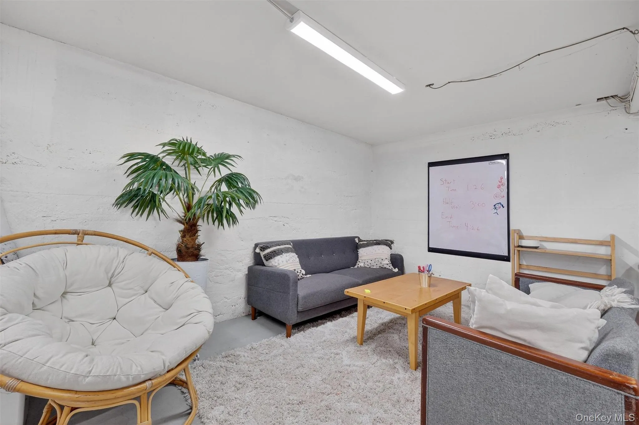 Living room featuring finished concrete flooring Living room featuring finished concrete flooring