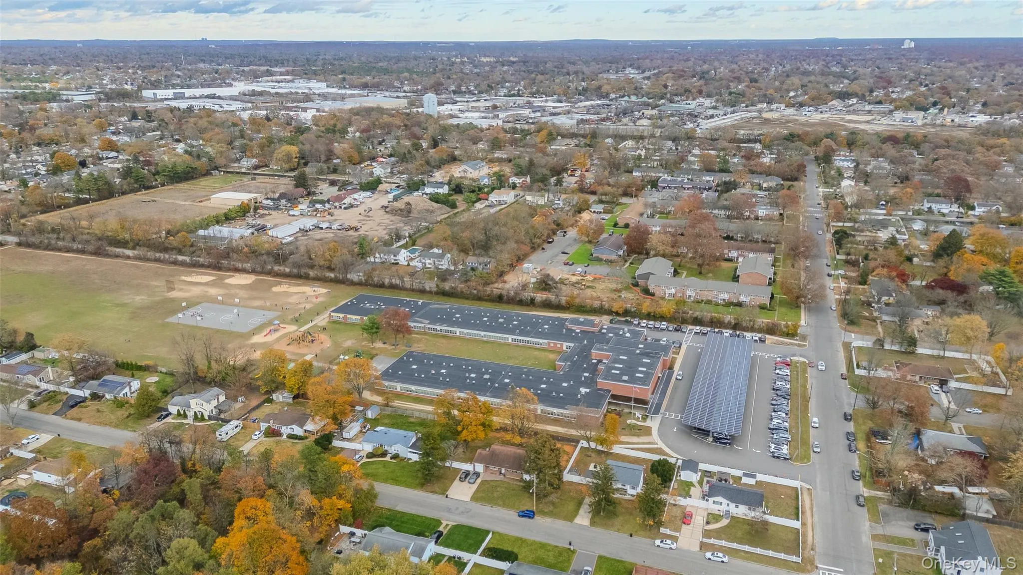 Aerial overview of property's location with nearby suburban area Aerial overview of property's location with nearby suburban area