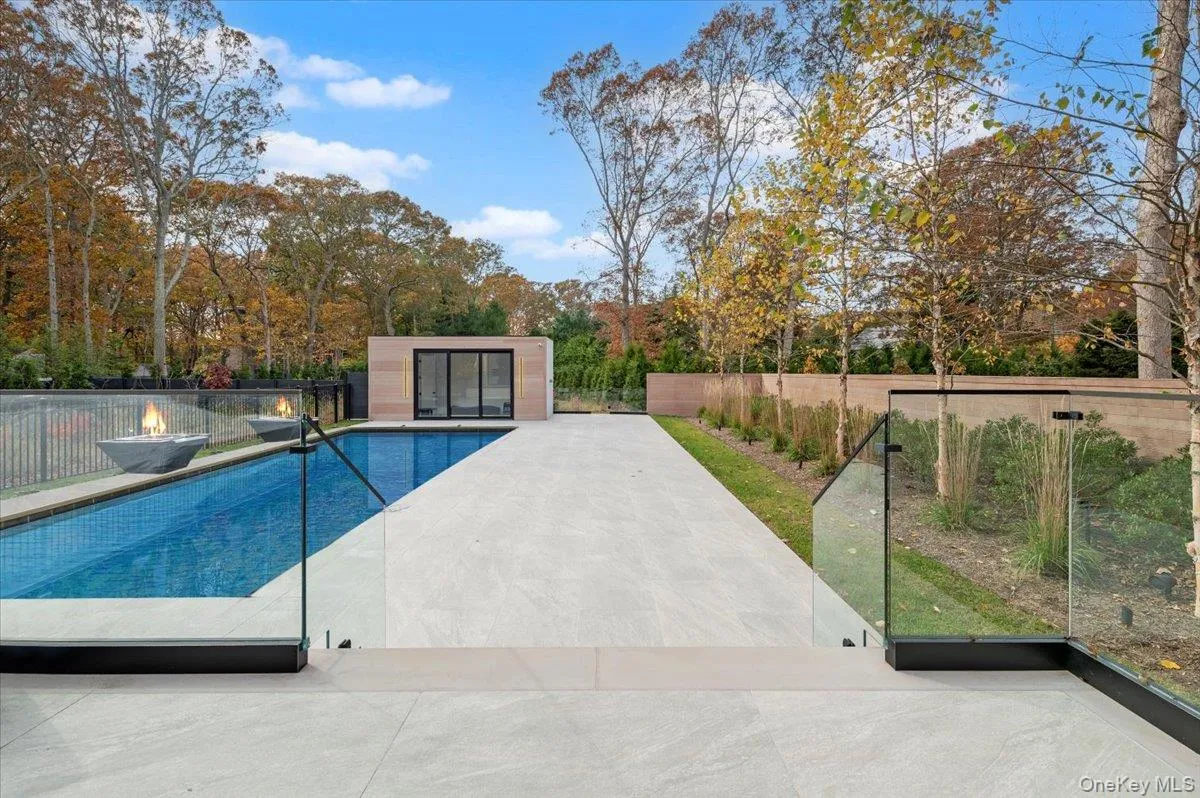 View of pool with a fenced backyard and a patio