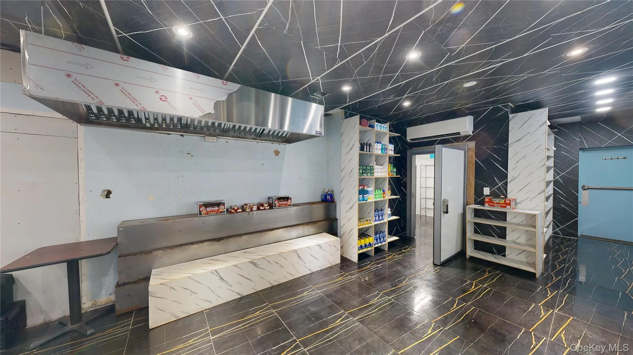 Basement with a wall mounted air conditioner Basement with a wall mounted air conditioner