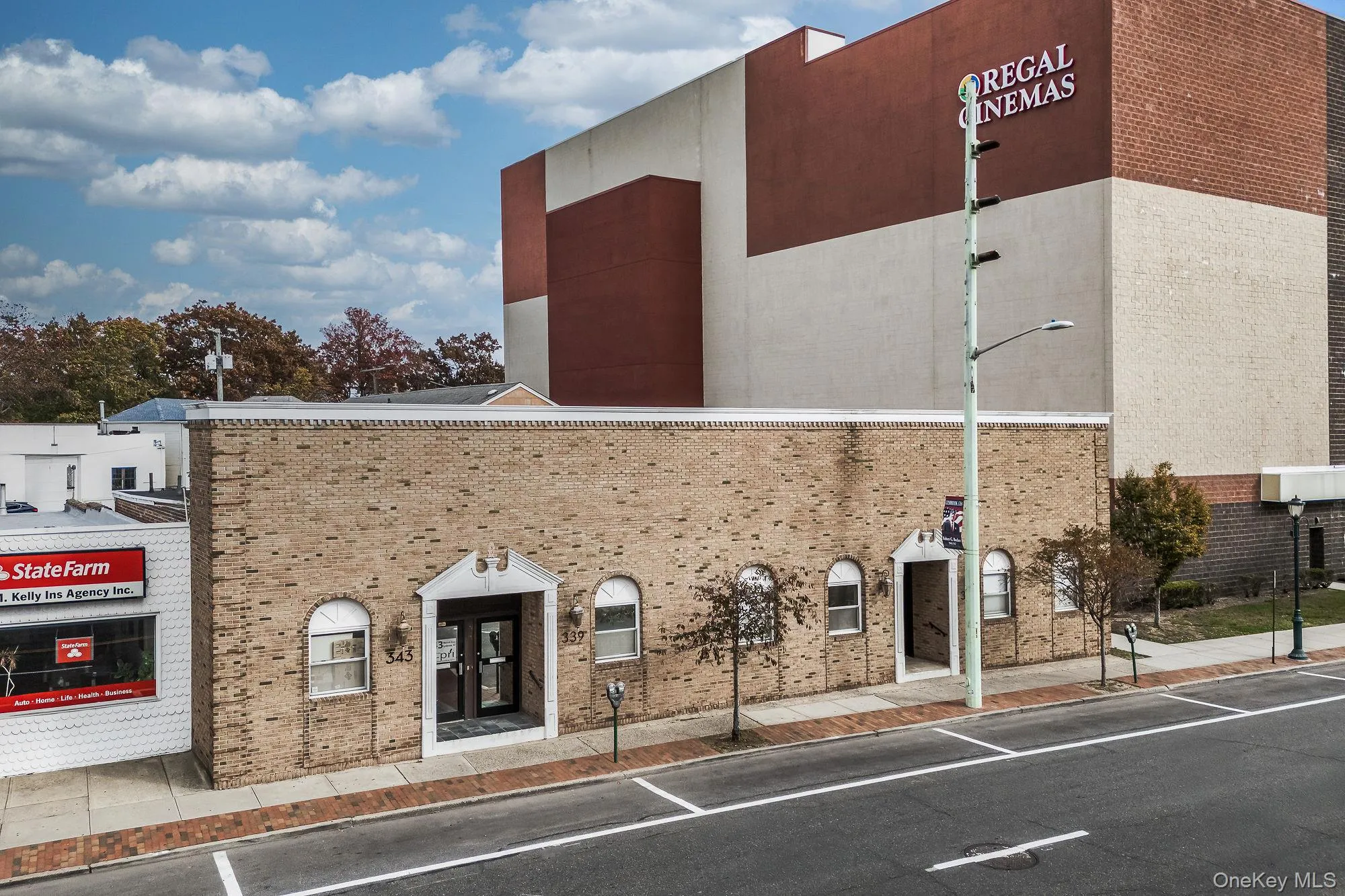 View of building exterior with uncovered parking View of building exterior with uncovered parking