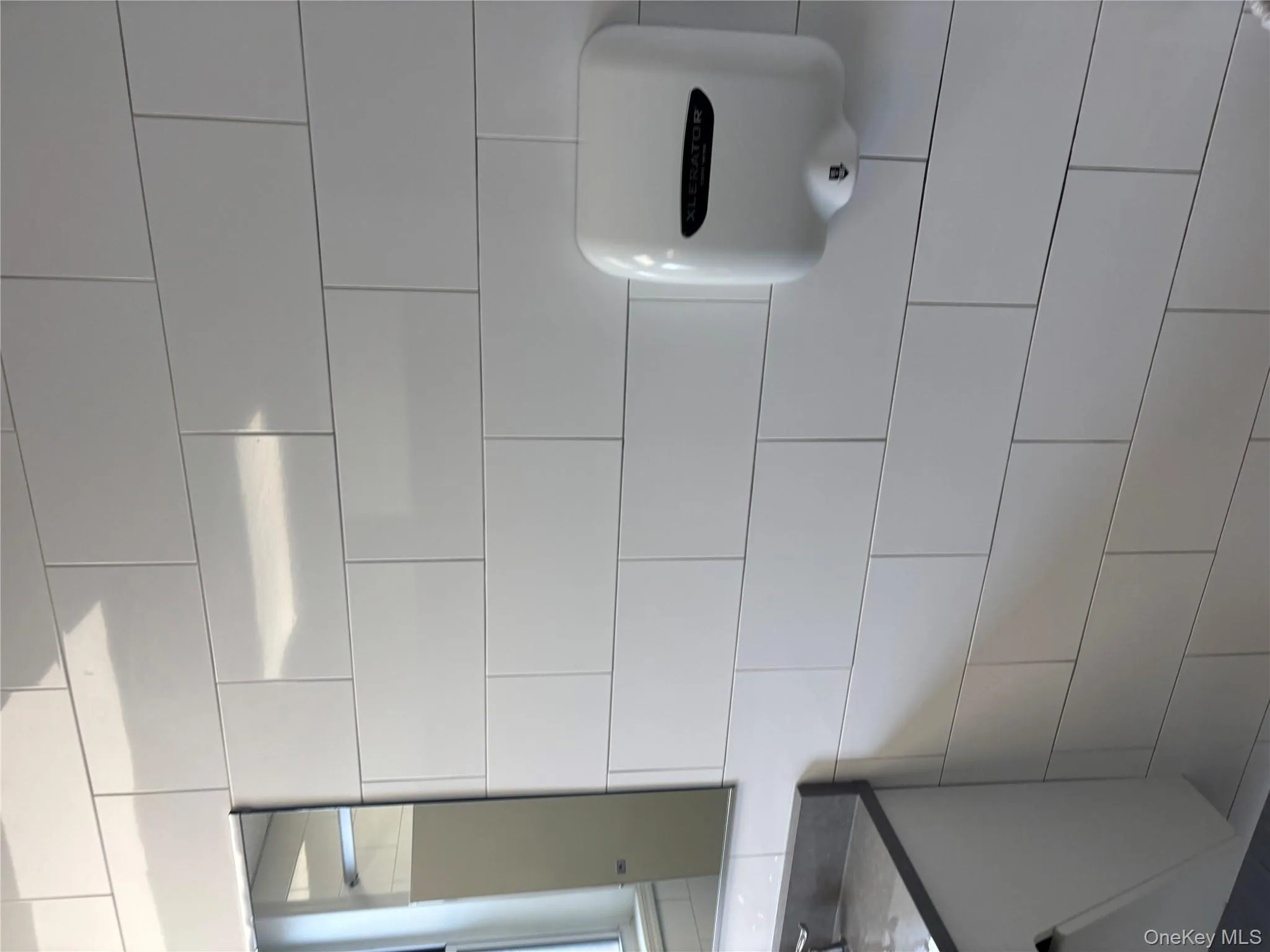 Bathroom view of vanity and tile walls Bathroom view of vanity and tile walls