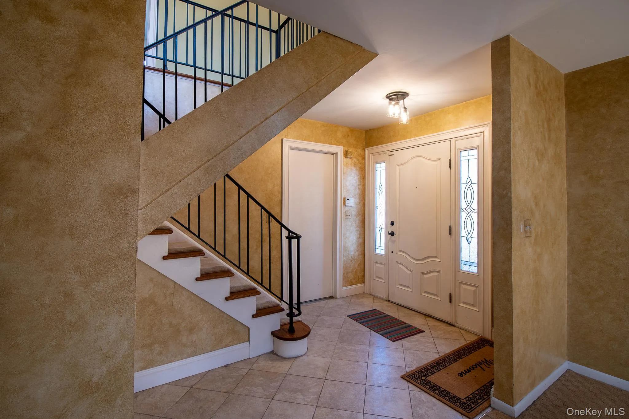 Upstairs to main living area. To the left before going upstairs is the family room. Upstairs to main living area. To the left before going upstairs is the family room.