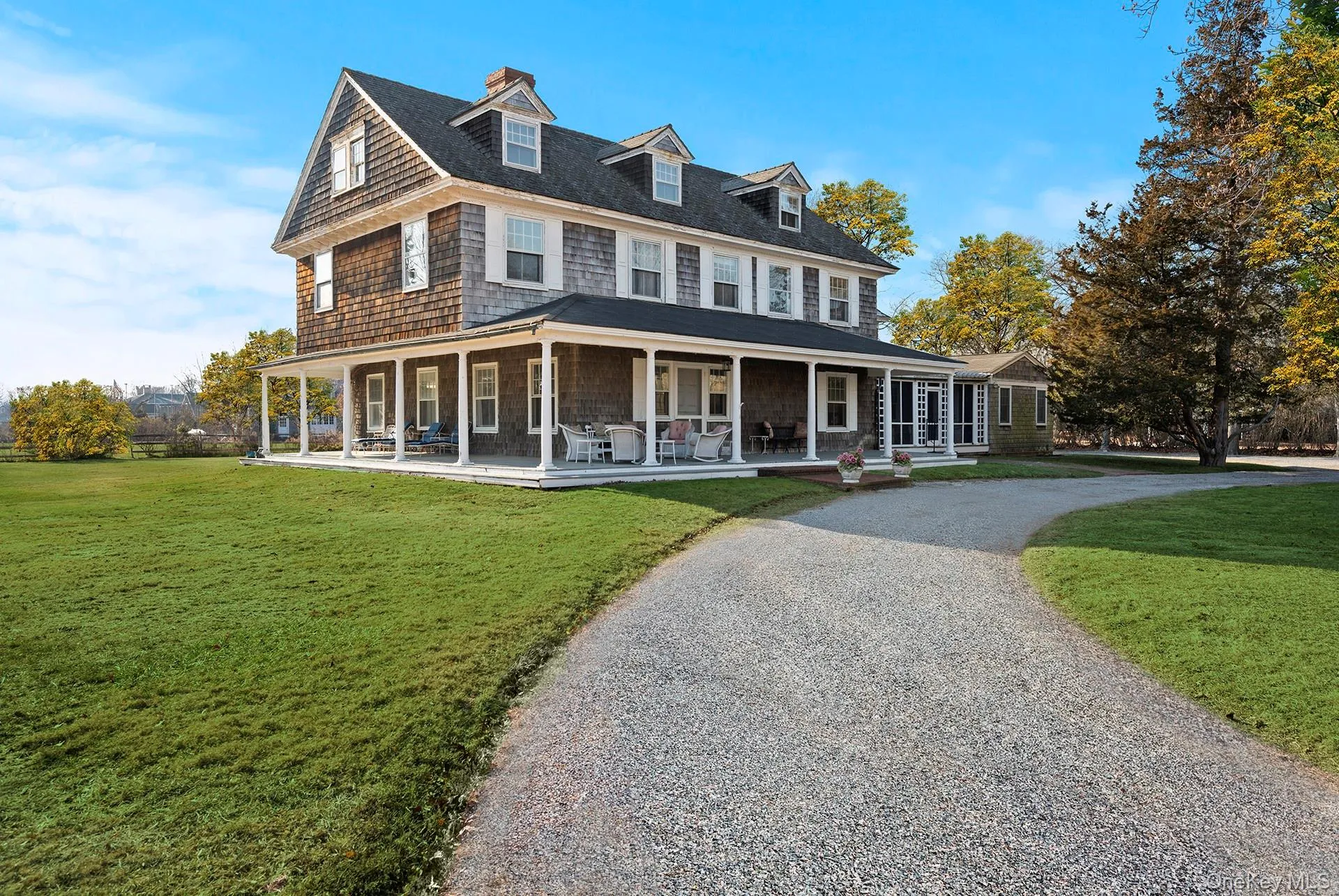 View of front of property with a covered porch and a front yard View of front of property with a covered porch and a front yard