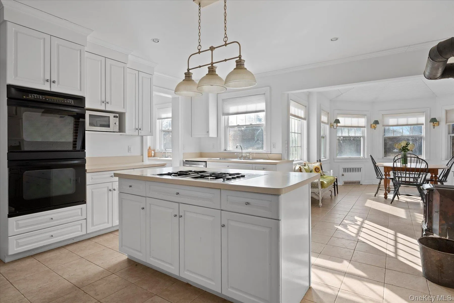 Kitchen with white cabinetry, ornamental molding, pendant lighting, Kitchen with white cabinetry, ornamental molding, pendant lighting,