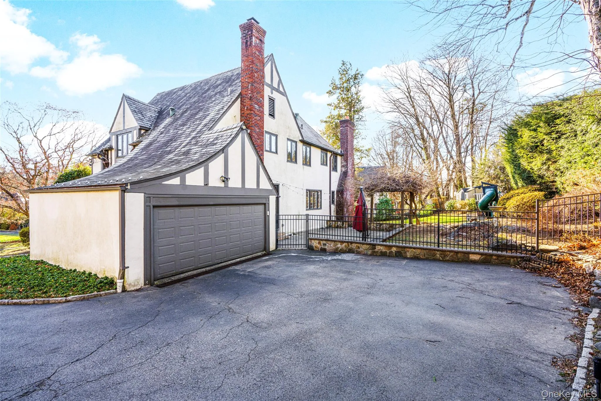 Big driveway and view of garage. Big driveway and view of garage.