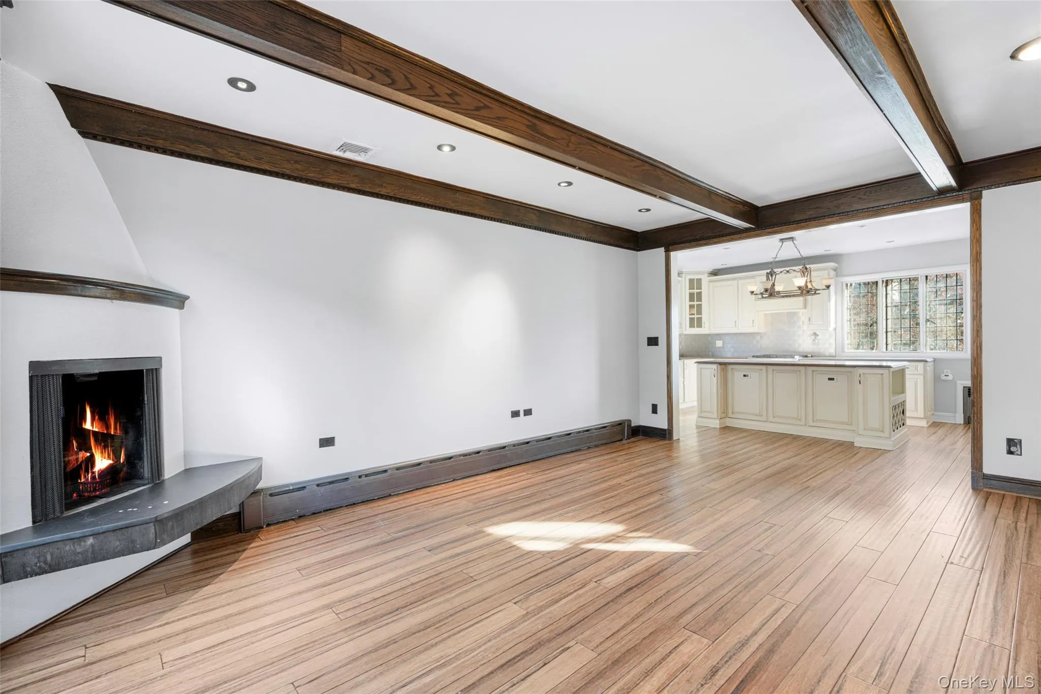 Family room with adjacent eat in kitchen. Family room with adjacent eat in kitchen.