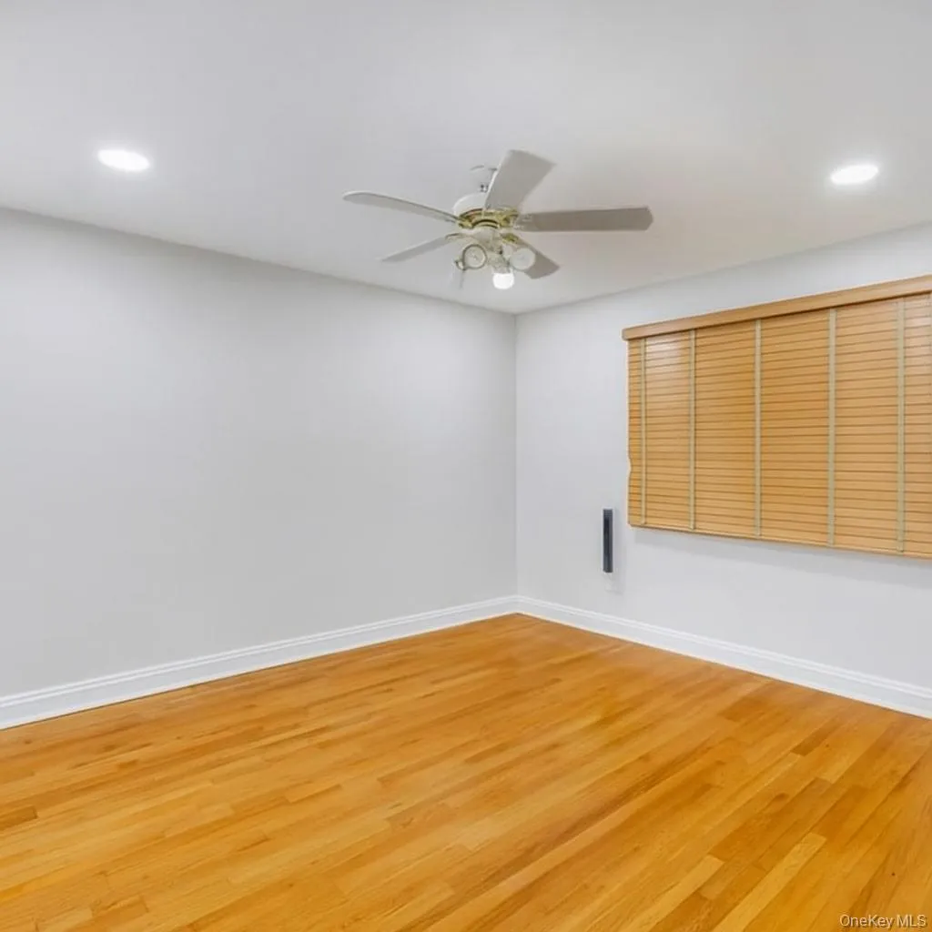 Unfurnished bedroom featuring recessed lighting, wood finished floors, and a ceiling fan Unfurnished bedroom featuring recessed lighting, wood finished floors, and a ceiling fan