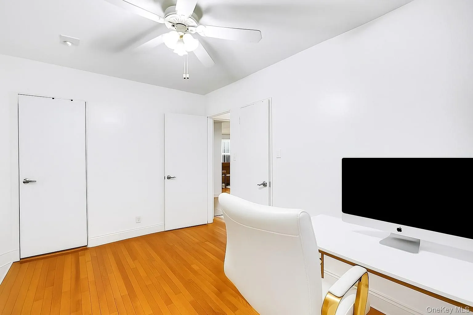 Bedroom featuring light wood-style floors and a ceiling fan Bedroom featuring light wood-style floors and a ceiling fan