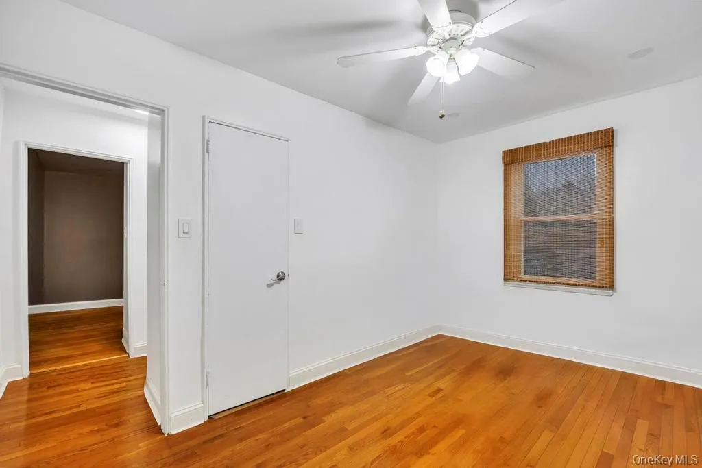 Unfurnished bedroom featuring light wood finished floors and ceiling fan Unfurnished bedroom featuring light wood finished floors and ceiling fan