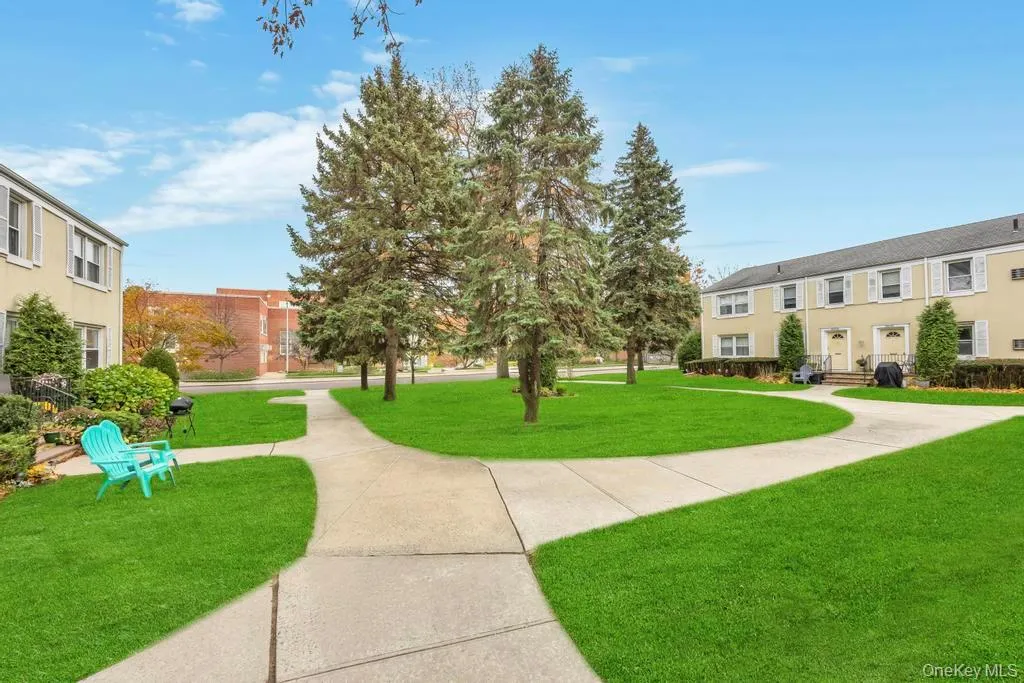View of home's community featuring a lawn View of home's community featuring a lawn