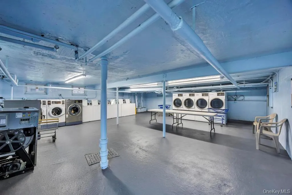 Below grade area featuring independent washer and dryer Below grade area featuring independent washer and dryer