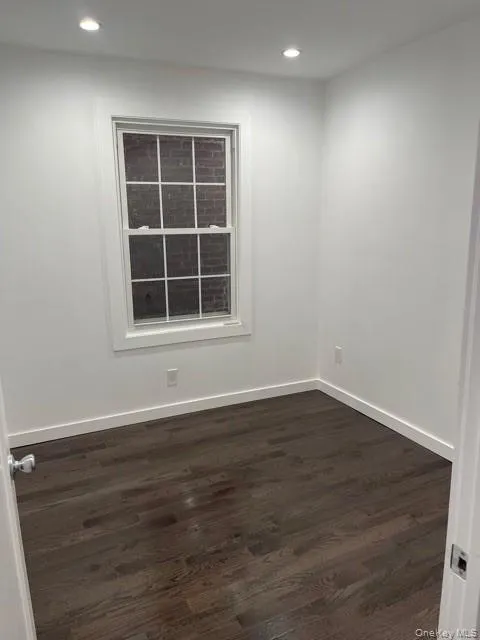 Unfurnished room featuring dark wood-type flooring and recessed lighting Unfurnished room featuring dark wood-type flooring and recessed lighting