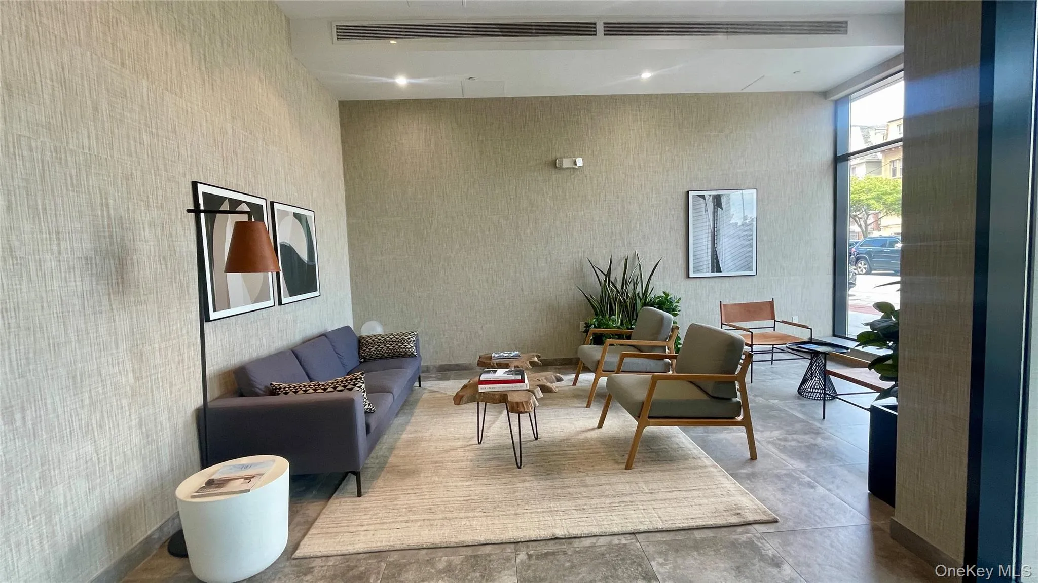 Community lobby with floor to ceiling windows Community lobby with floor to ceiling windows