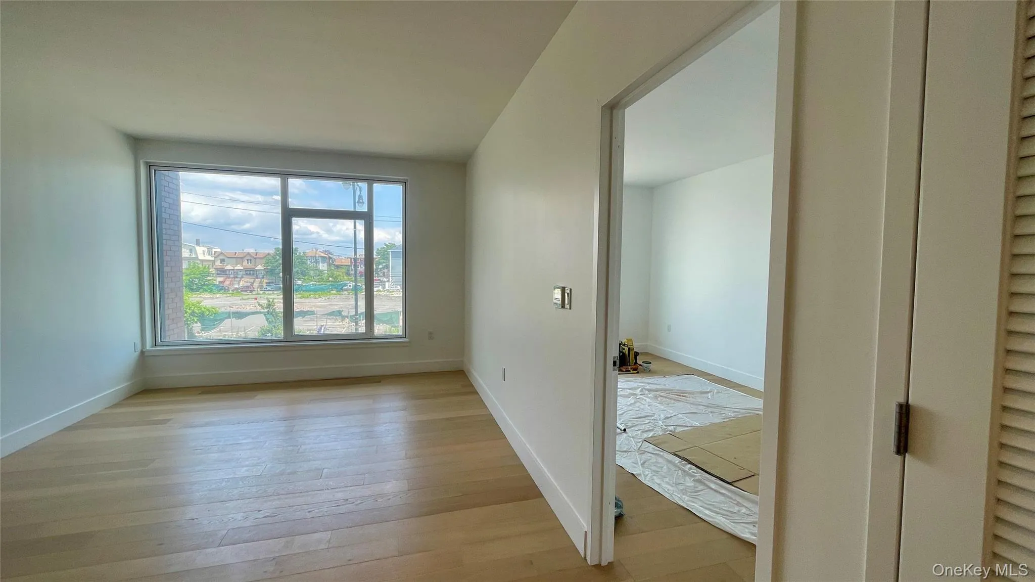 Empty room featuring light wood-style flooring and baseboards Empty room featuring light wood-style flooring and baseboards