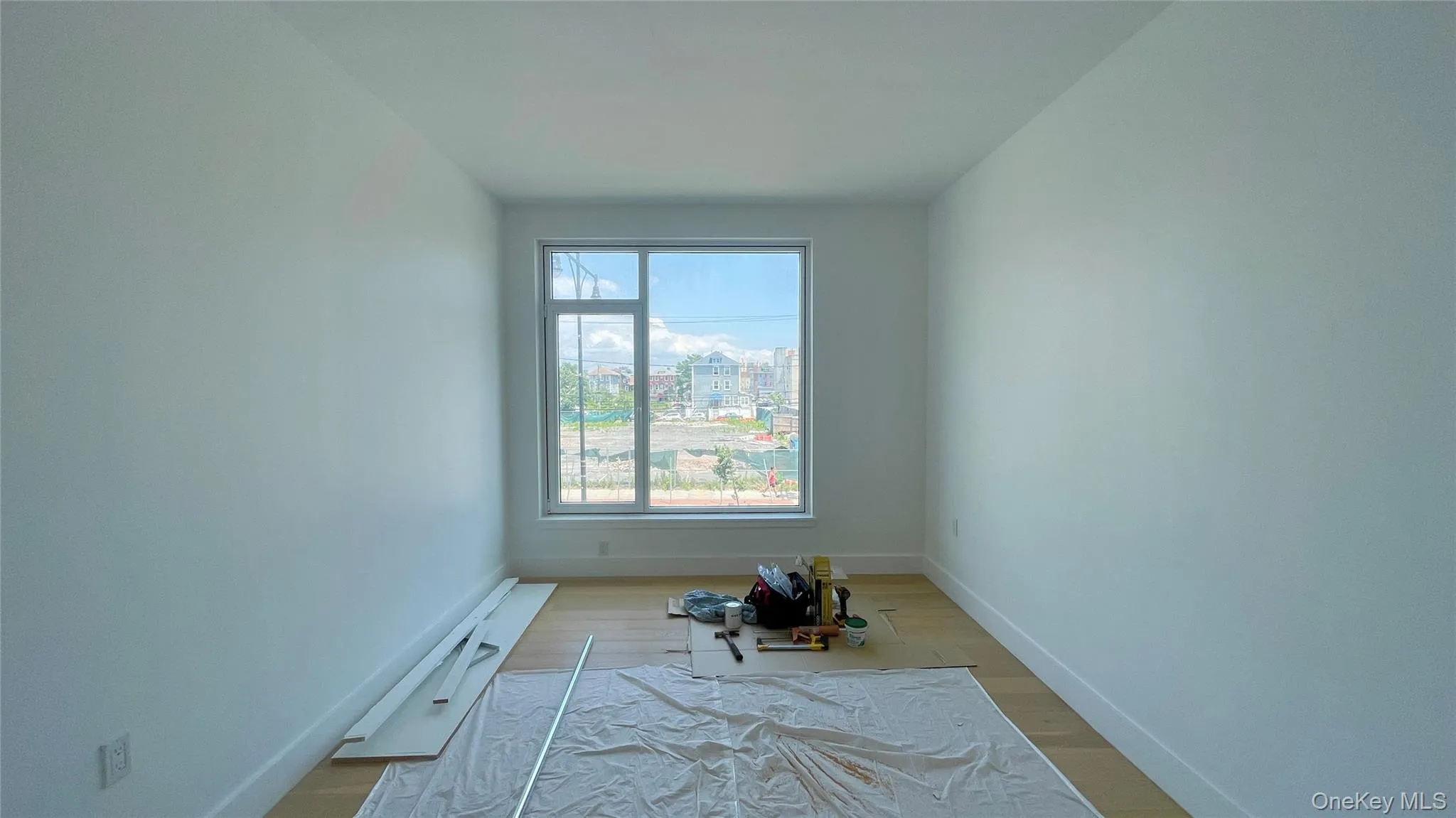 Unfurnished room featuring wood finished floors and baseboards Unfurnished room featuring wood finished floors and baseboards