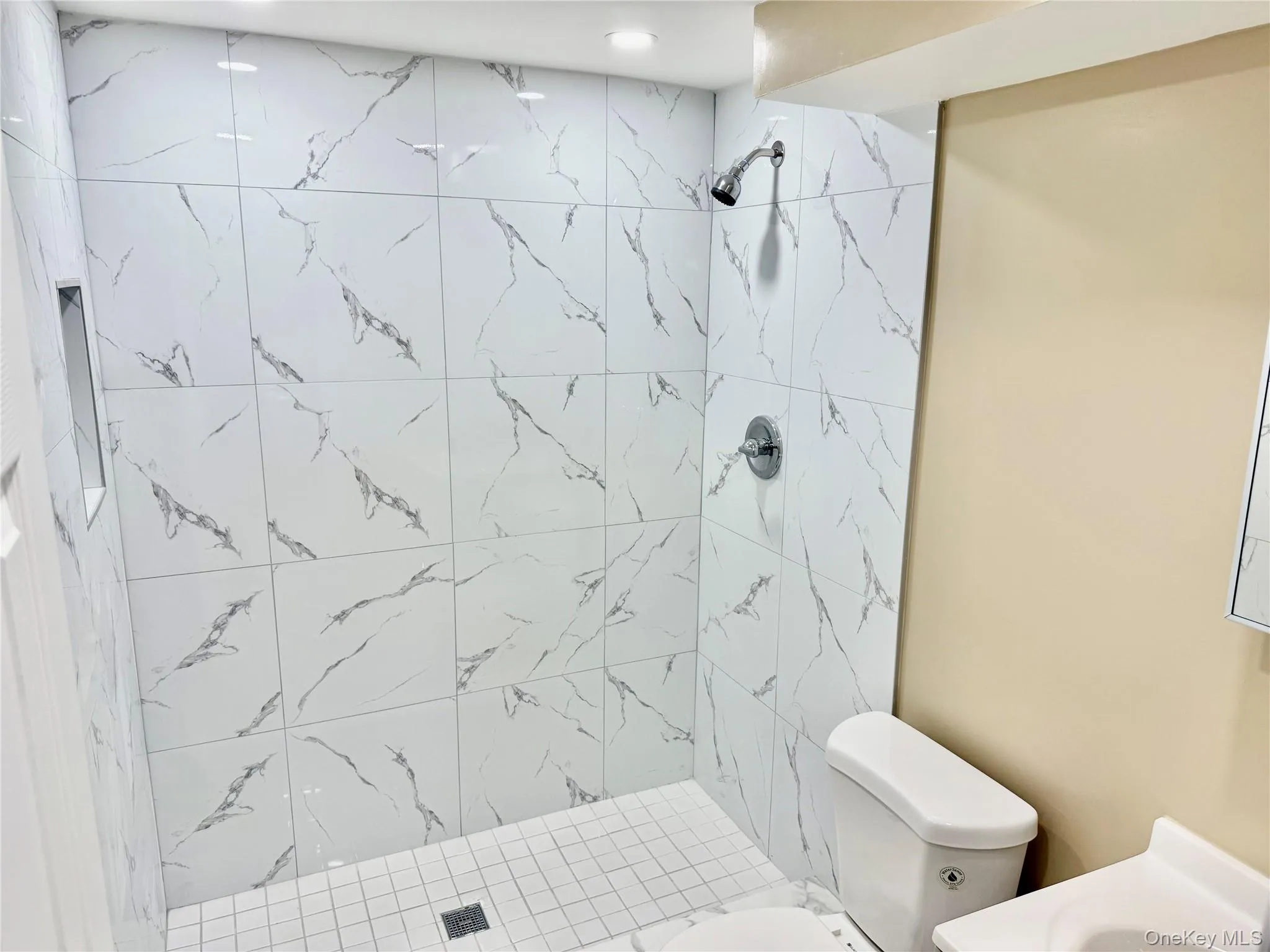 Bathroom featuring vanity and a stall shower Bathroom featuring vanity and a stall shower