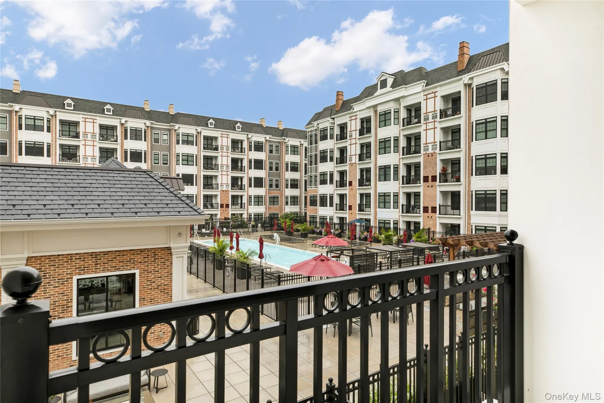 Balcony with view of pool area Balcony with view of pool area