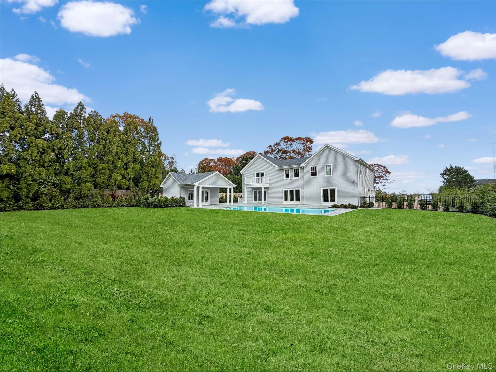 Rear view of property featuring a yard and a patio Rear view of property featuring a yard and a patio