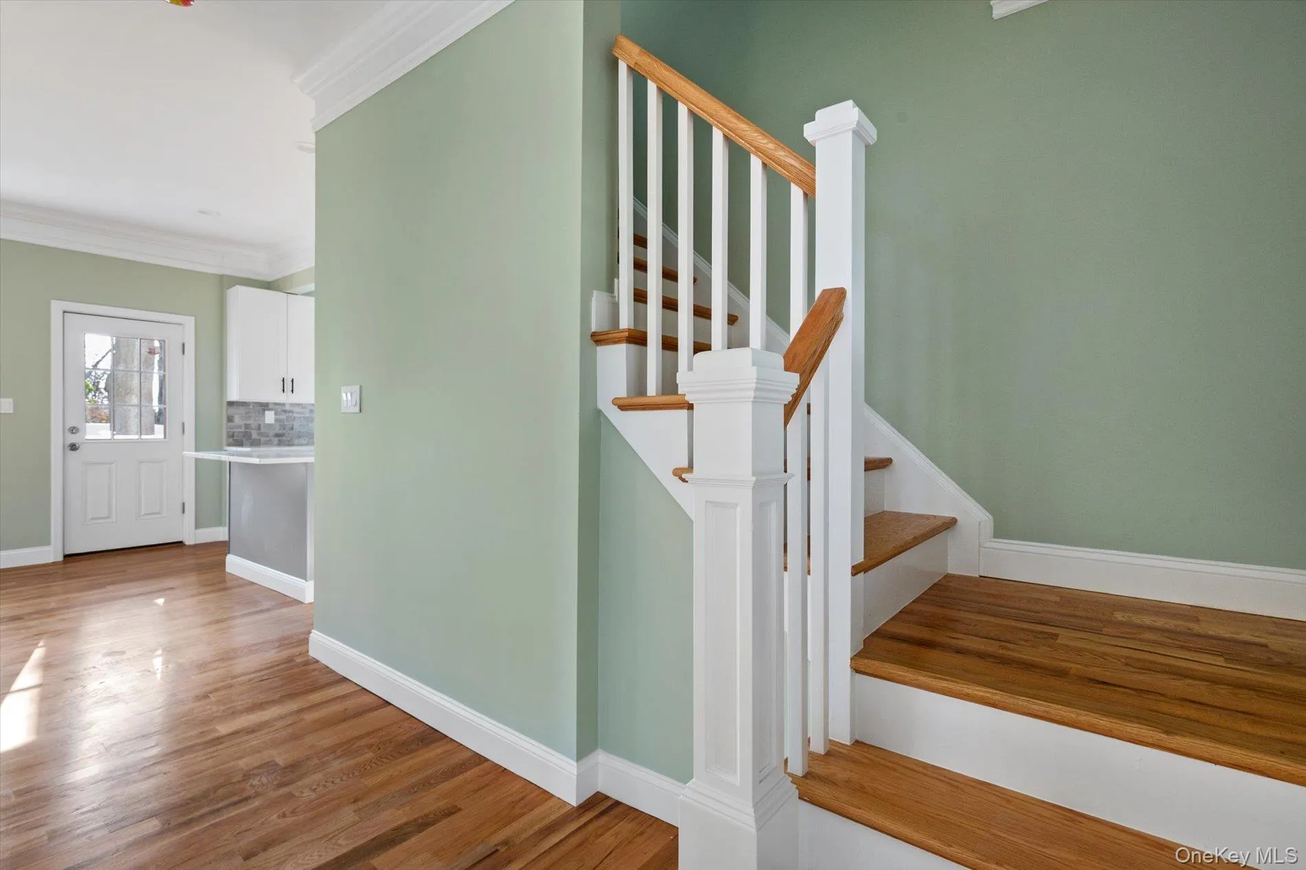 Stairs with ornamental molding and wood finished floors Stairs with ornamental molding and wood finished floors