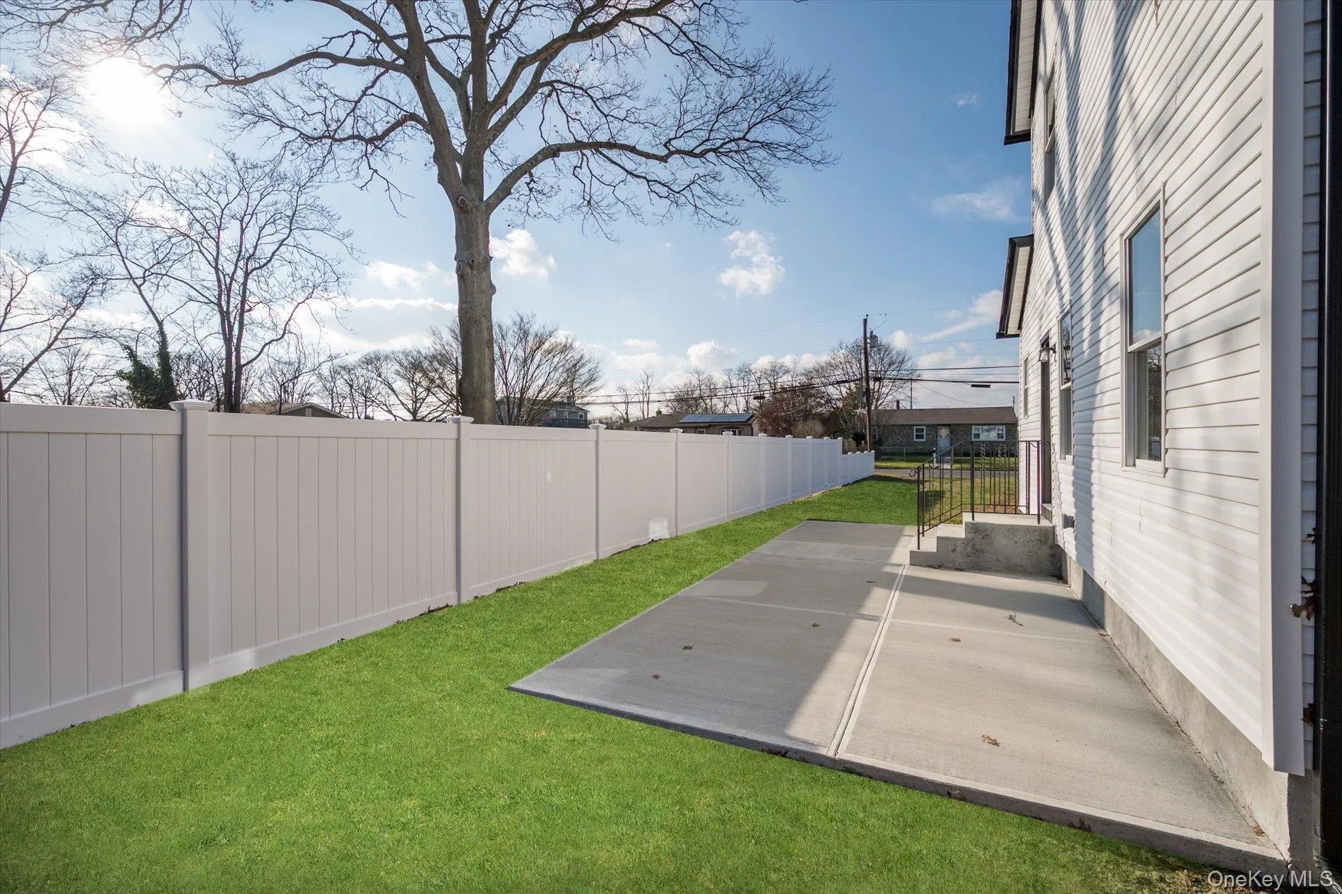 Fenced backyard featuring a patio area Fenced backyard featuring a patio area