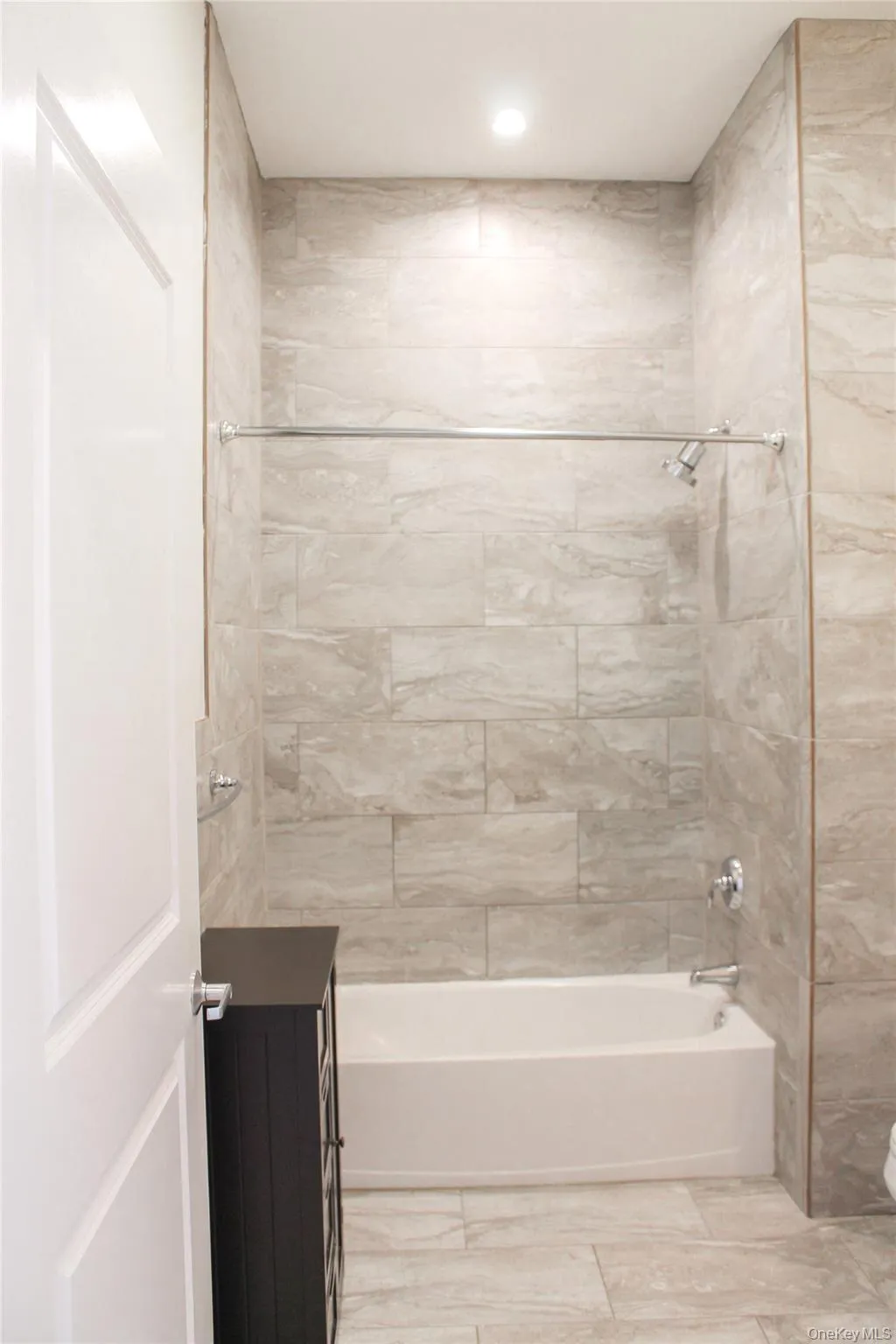 Full bath with washtub / shower combination, vanity, and recessed lighting Full bath with washtub / shower combination, vanity, and recessed lighting