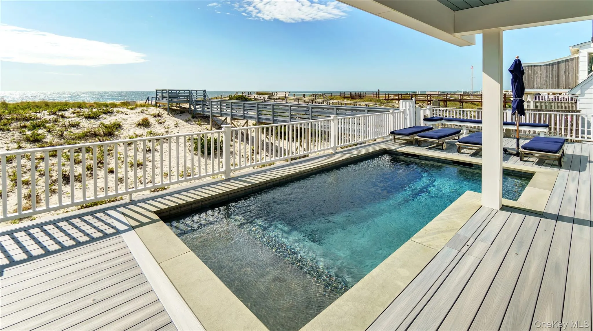 Swimming pool with a water view Swimming pool with a water view