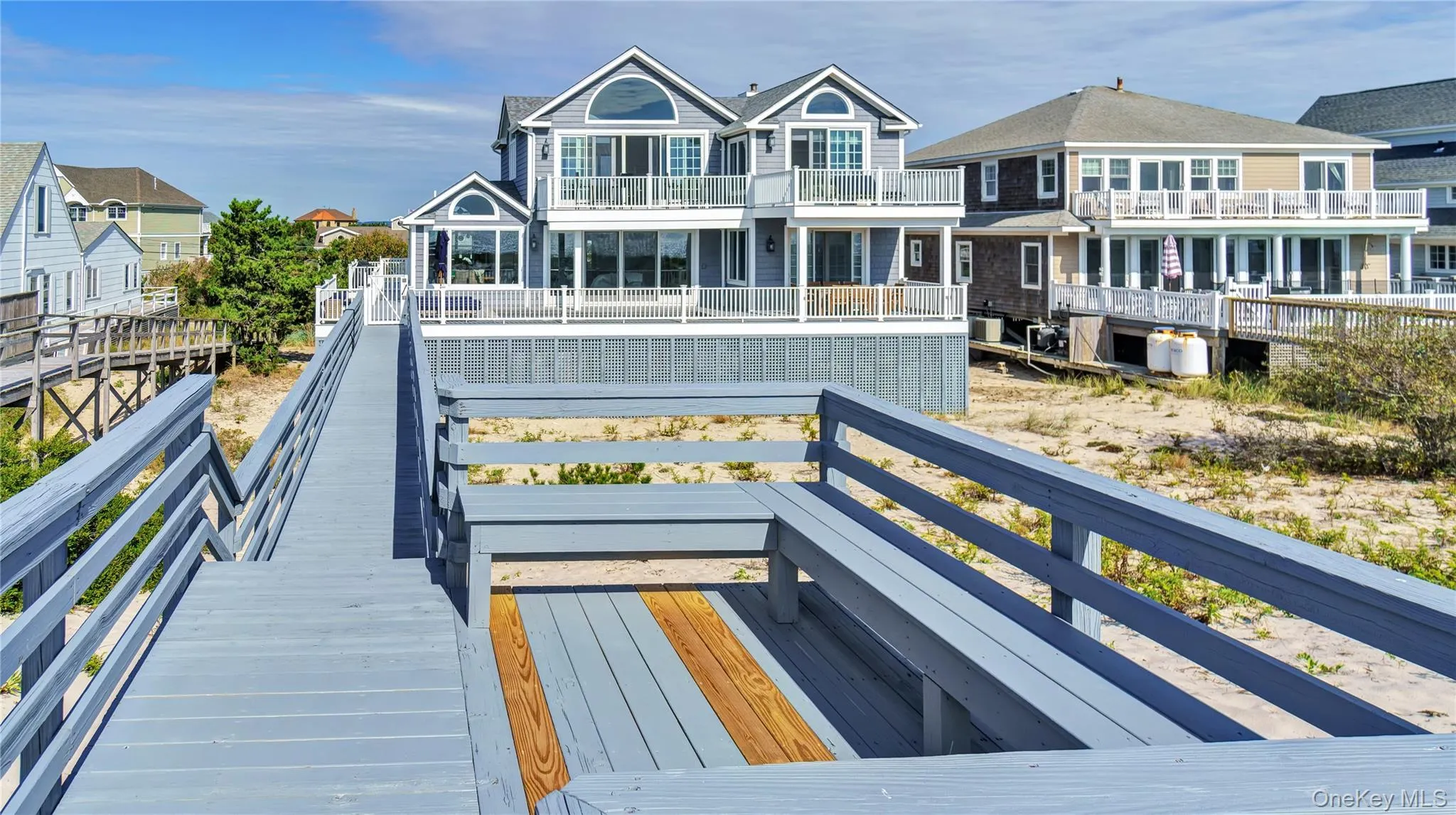 Rear view of property featuring a view of the ocean Rear view of property featuring a view of the ocean