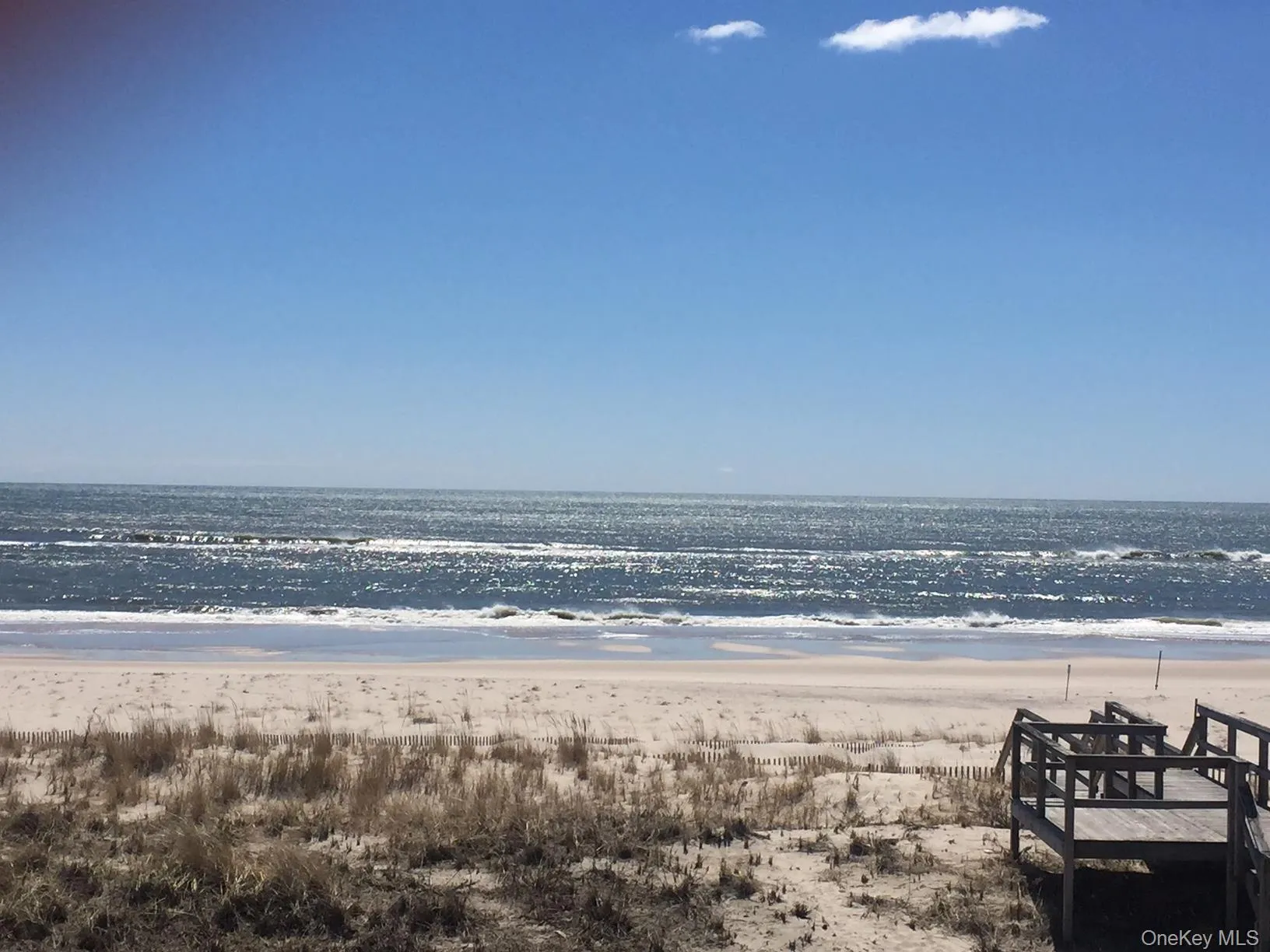 Water view featuring nearby beach Water view featuring nearby beach