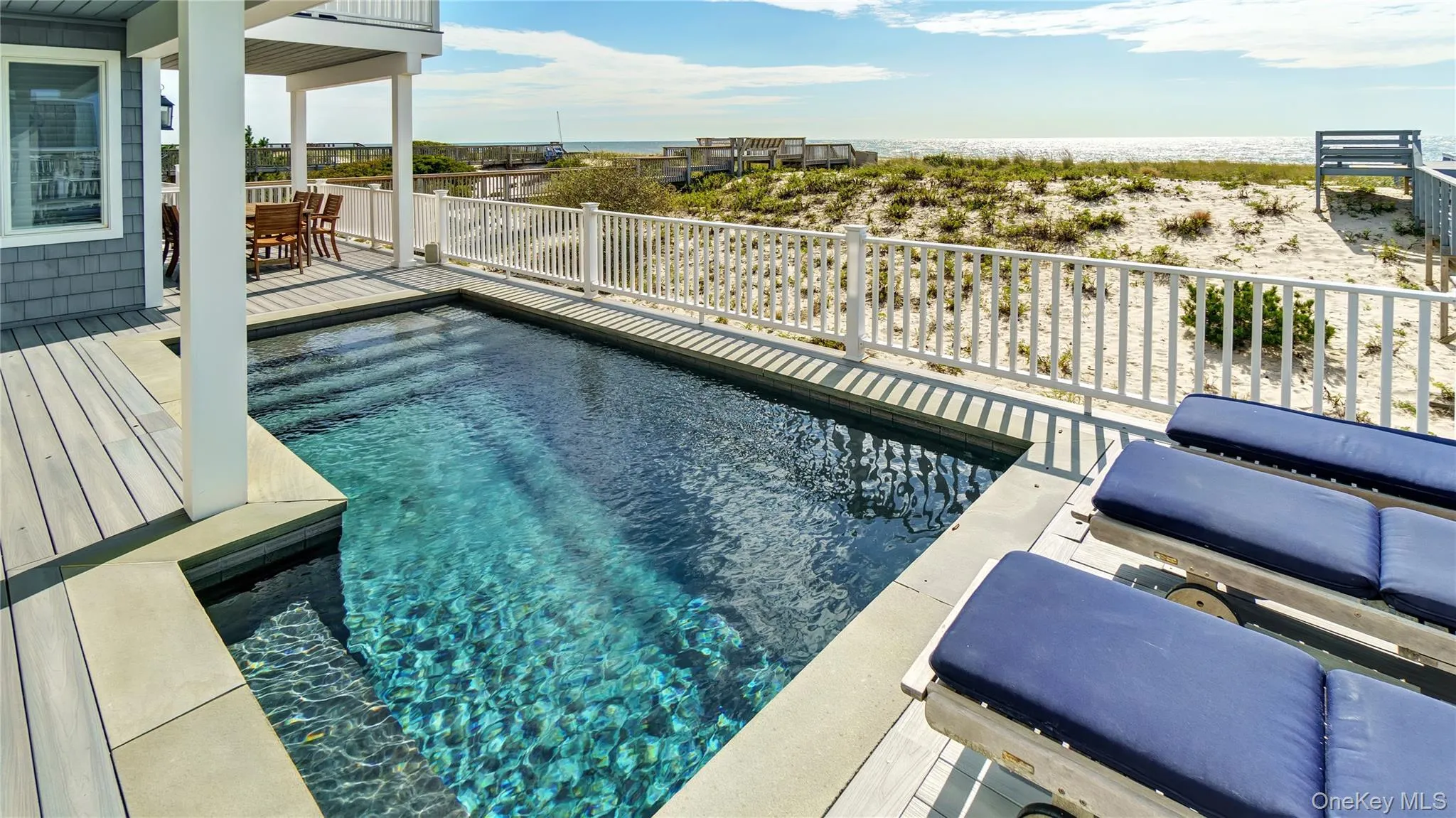 View of pool with outdoor dining area View of pool with outdoor dining area