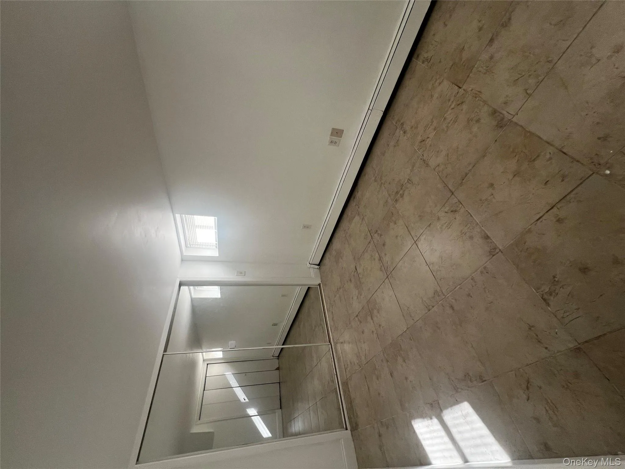 Unfurnished bedroom with a baseboard heating unit and a closet Unfurnished bedroom with a baseboard heating unit and a closet