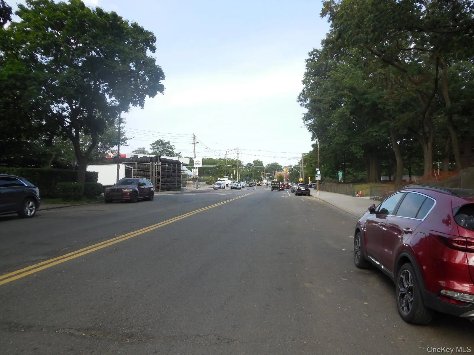 View of asphalt street featuring curbs and sidewalks View of asphalt street featuring curbs and sidewalks