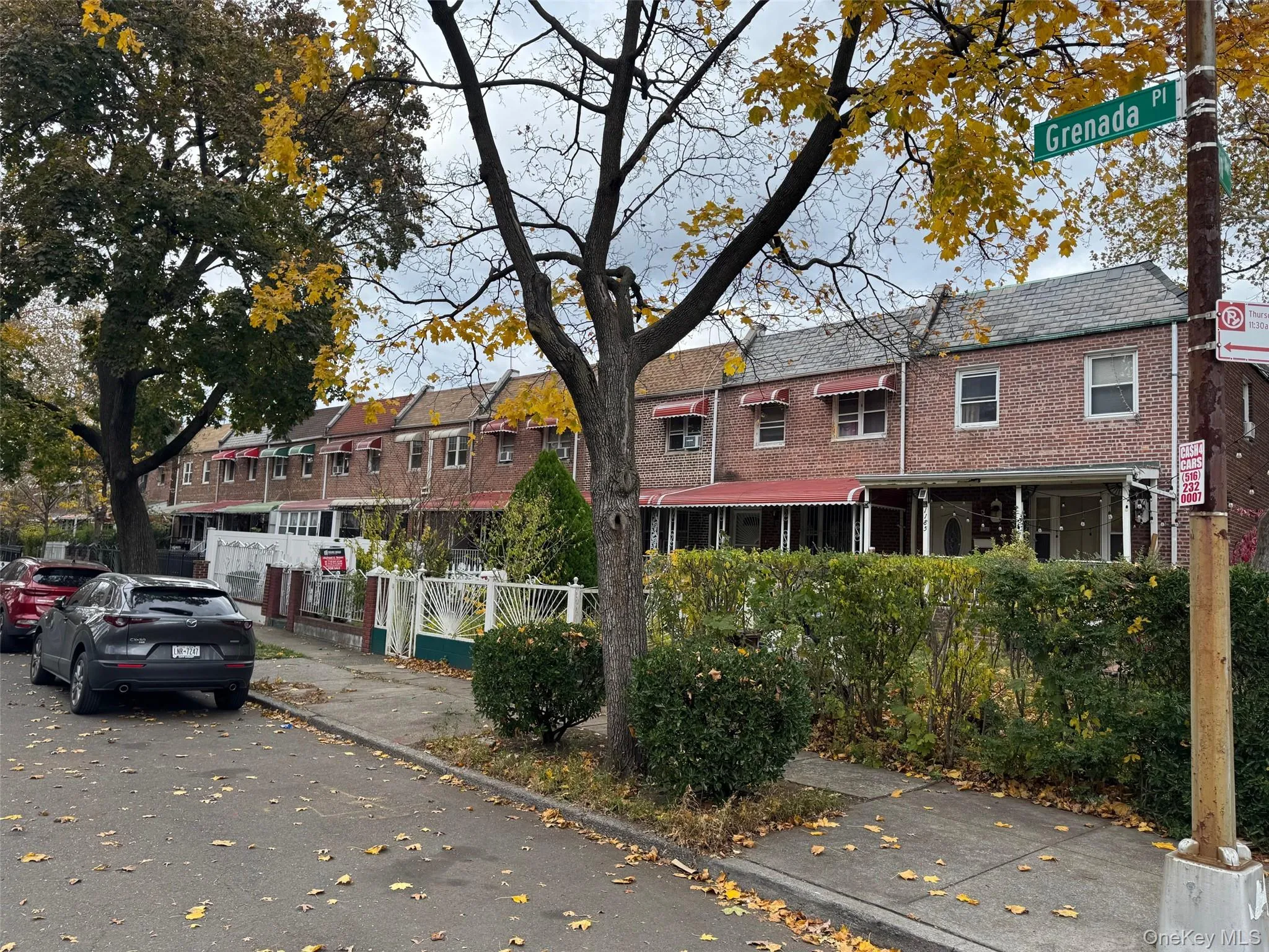 Traditional-style home with brick siding and mansard roof Traditional-style home with brick siding and mansard roof