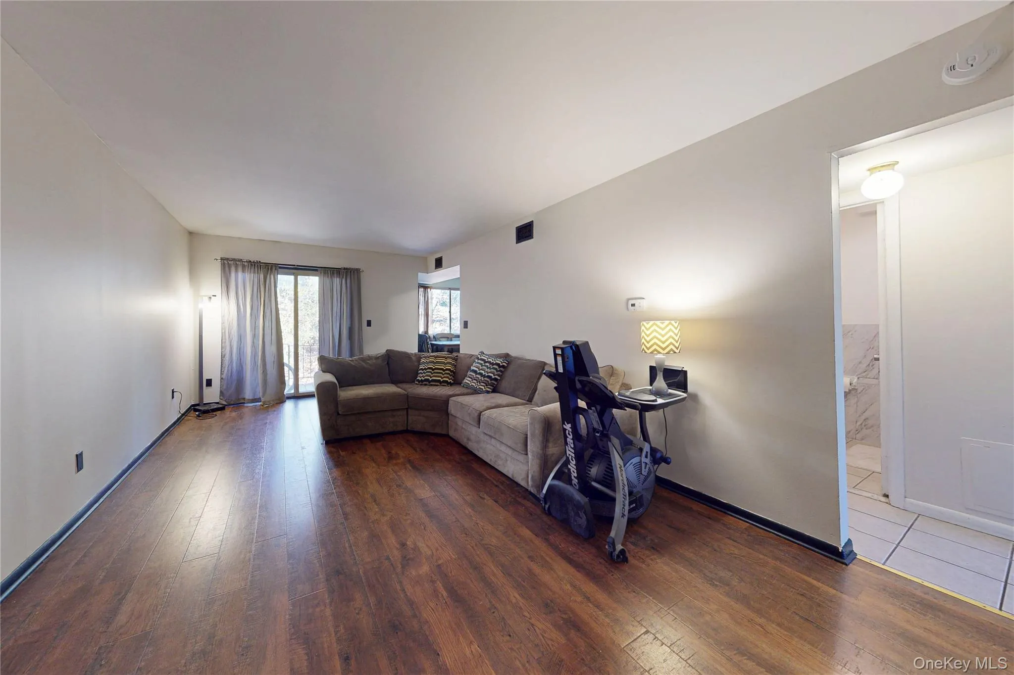 Living Room featuring luxury laminate flooring Living Room featuring luxury laminate flooring