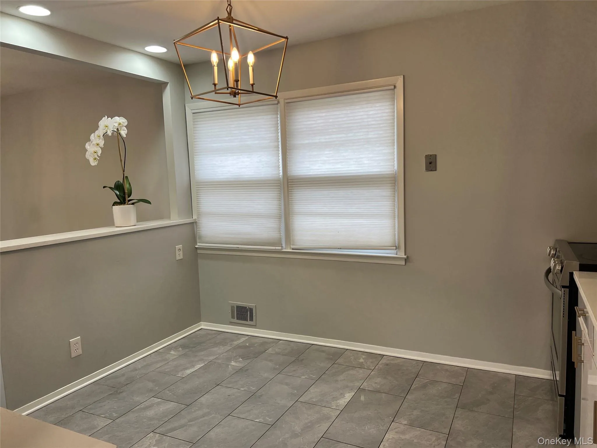 Dining area featuring a chandelier and recessed lighting Dining area featuring a chandelier and recessed lighting
