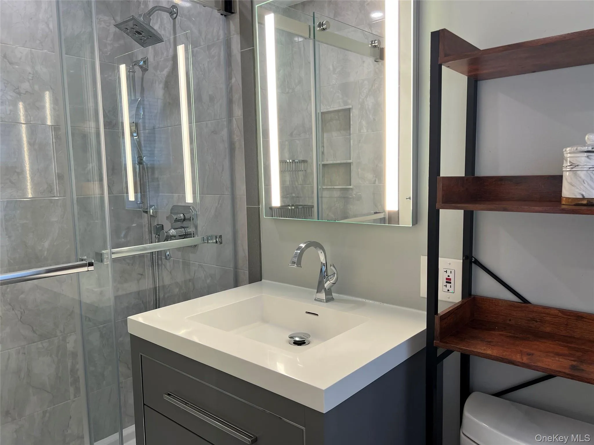 Bathroom with a stall shower and vanity Bathroom with a stall shower and vanity