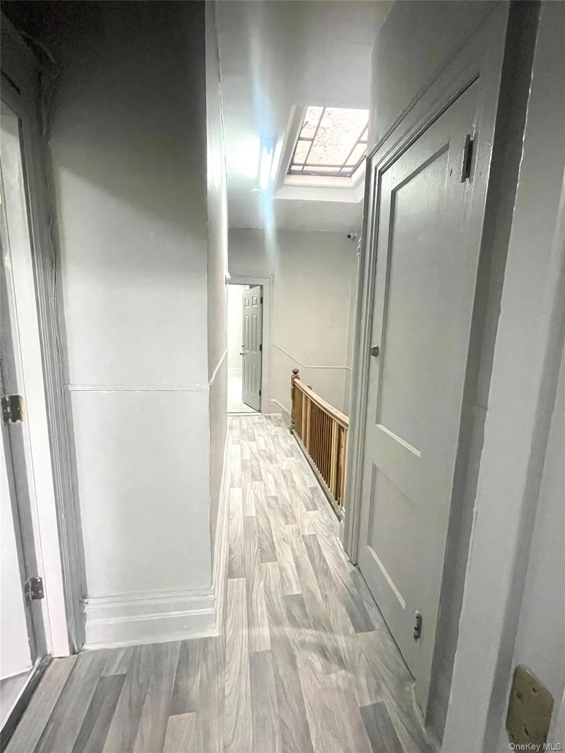 Hall featuring wood finished floors Hall featuring wood finished floors