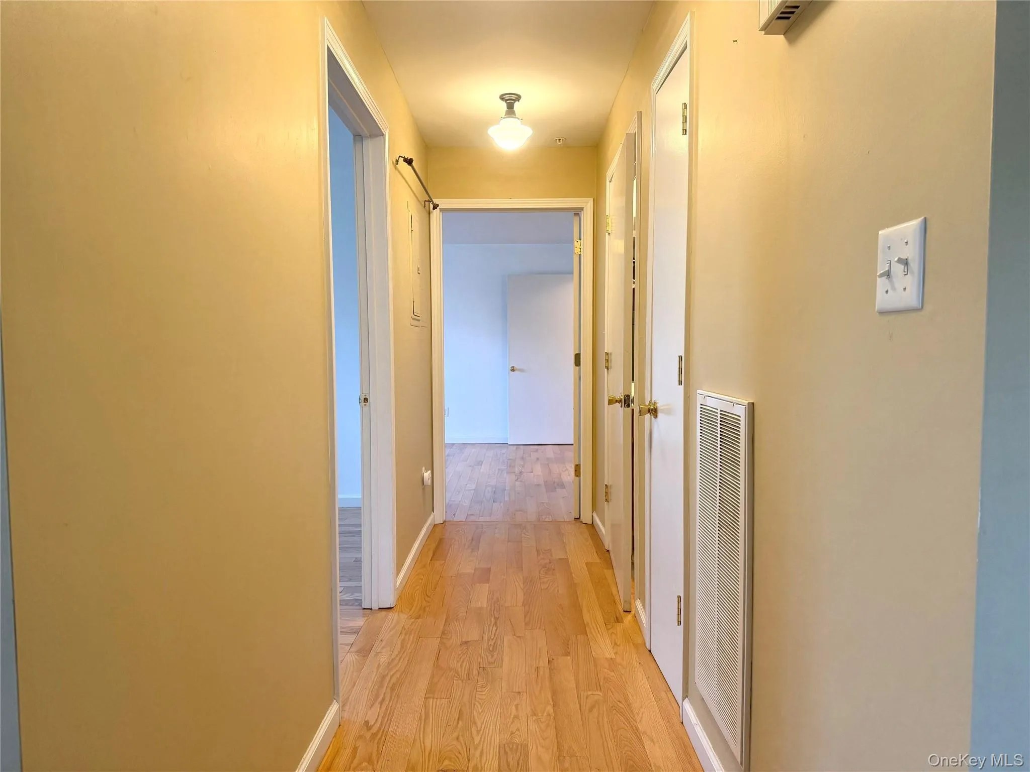 Hall featuring light wood-style floors Hall featuring light wood-style floors