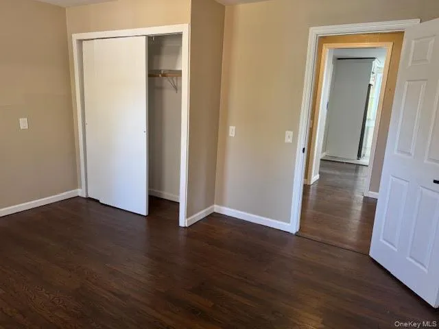 Bedroom #2 with freshly refinish hard wood floors and a closet. Bedroom #2 with freshly refinish hard wood floors and a closet.
