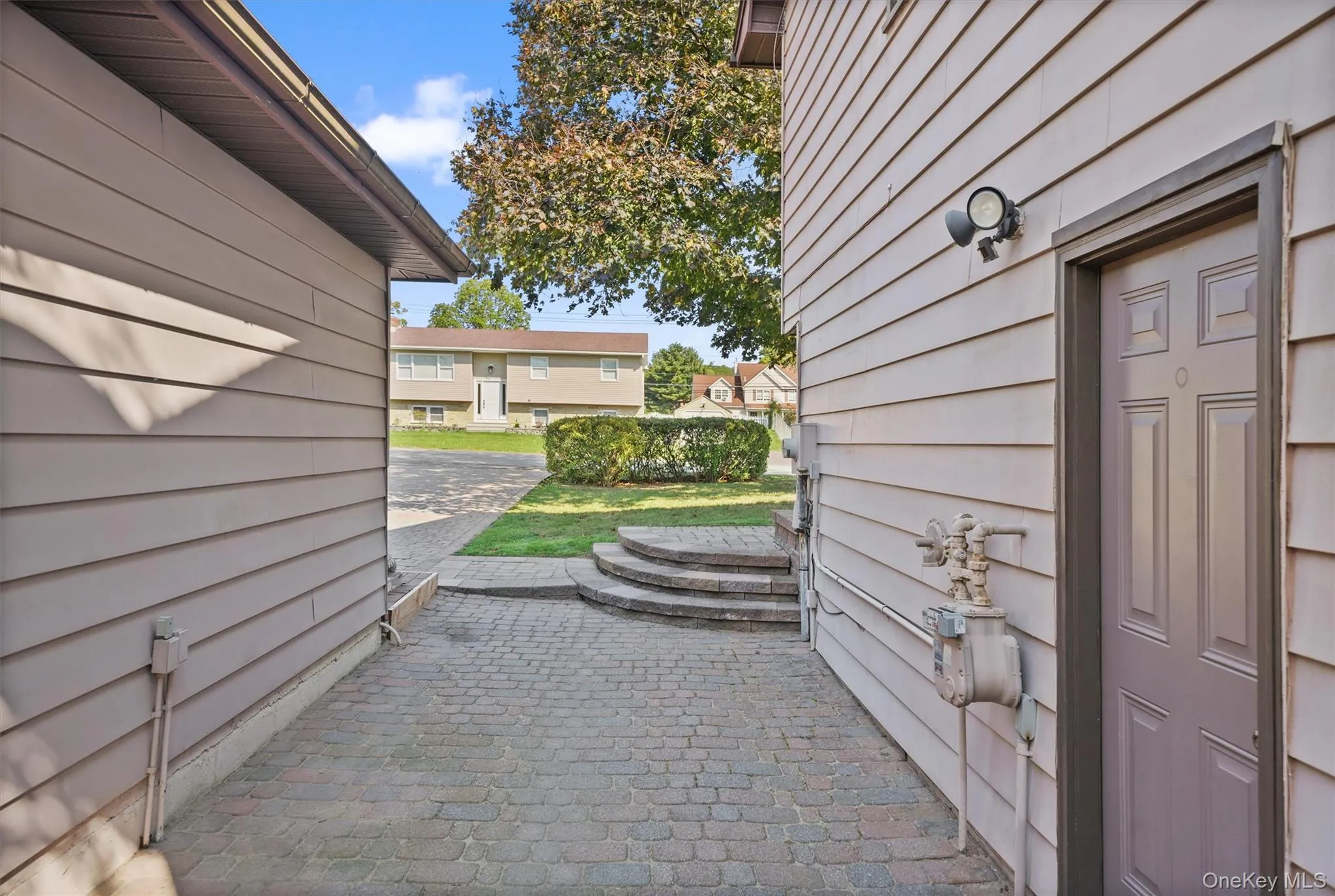 Breezeway between 2-car garage and home. Breezeway between 2-car garage and home.