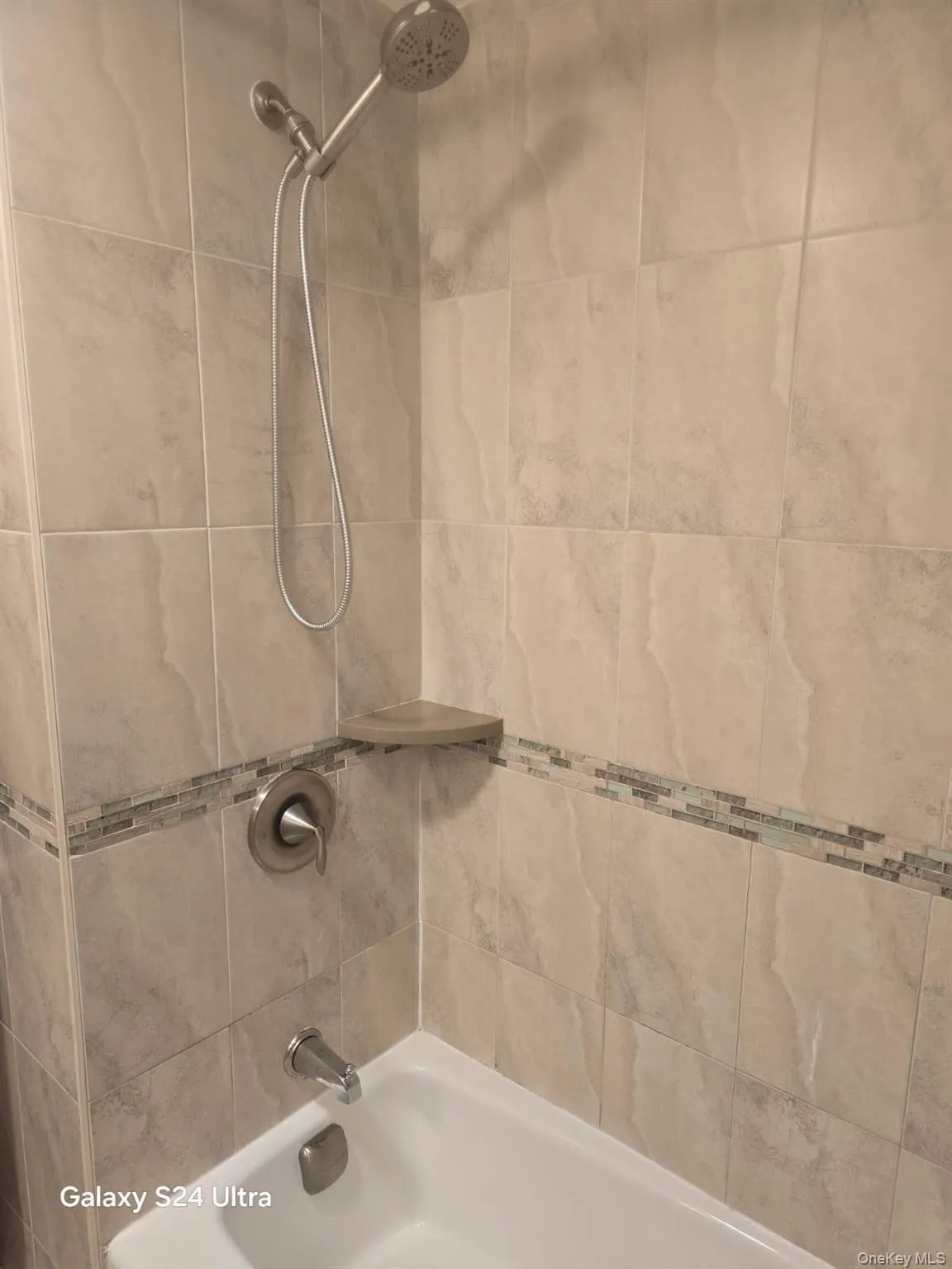 Bathroom featuring washtub / shower combination Bathroom featuring washtub / shower combination