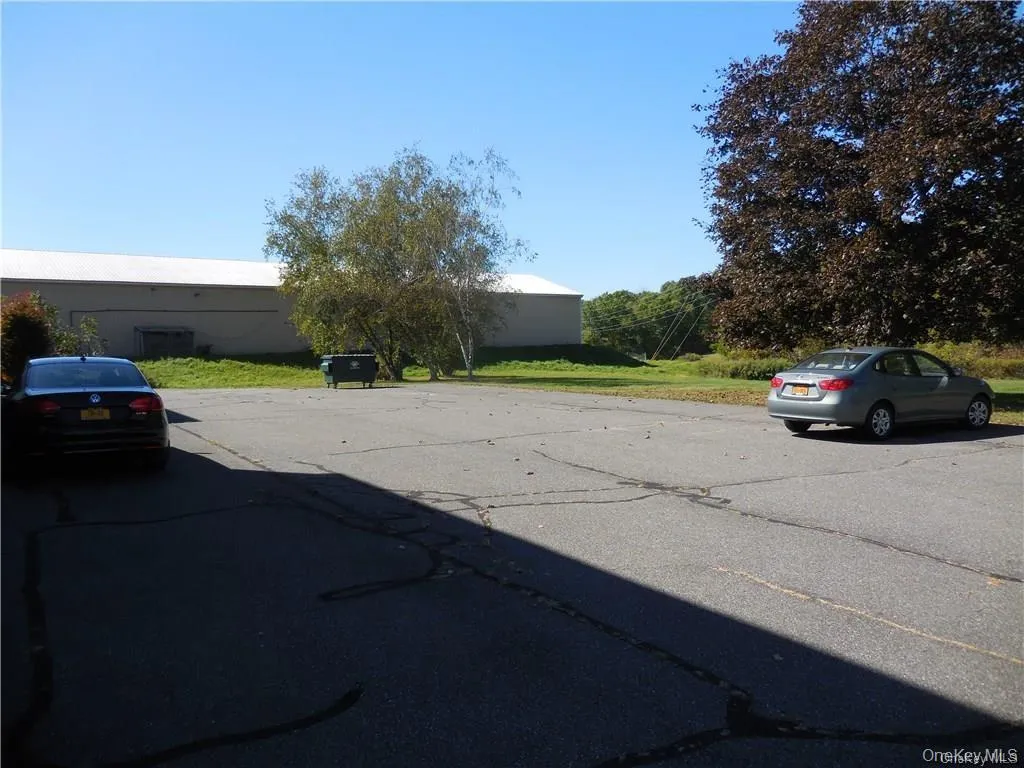 Back of the building parking area. Back of the building parking area.