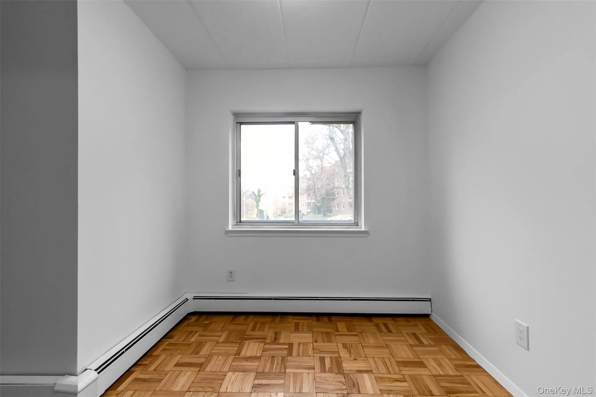 Unfurnished room featuring baseboard heating Unfurnished room featuring baseboard heating