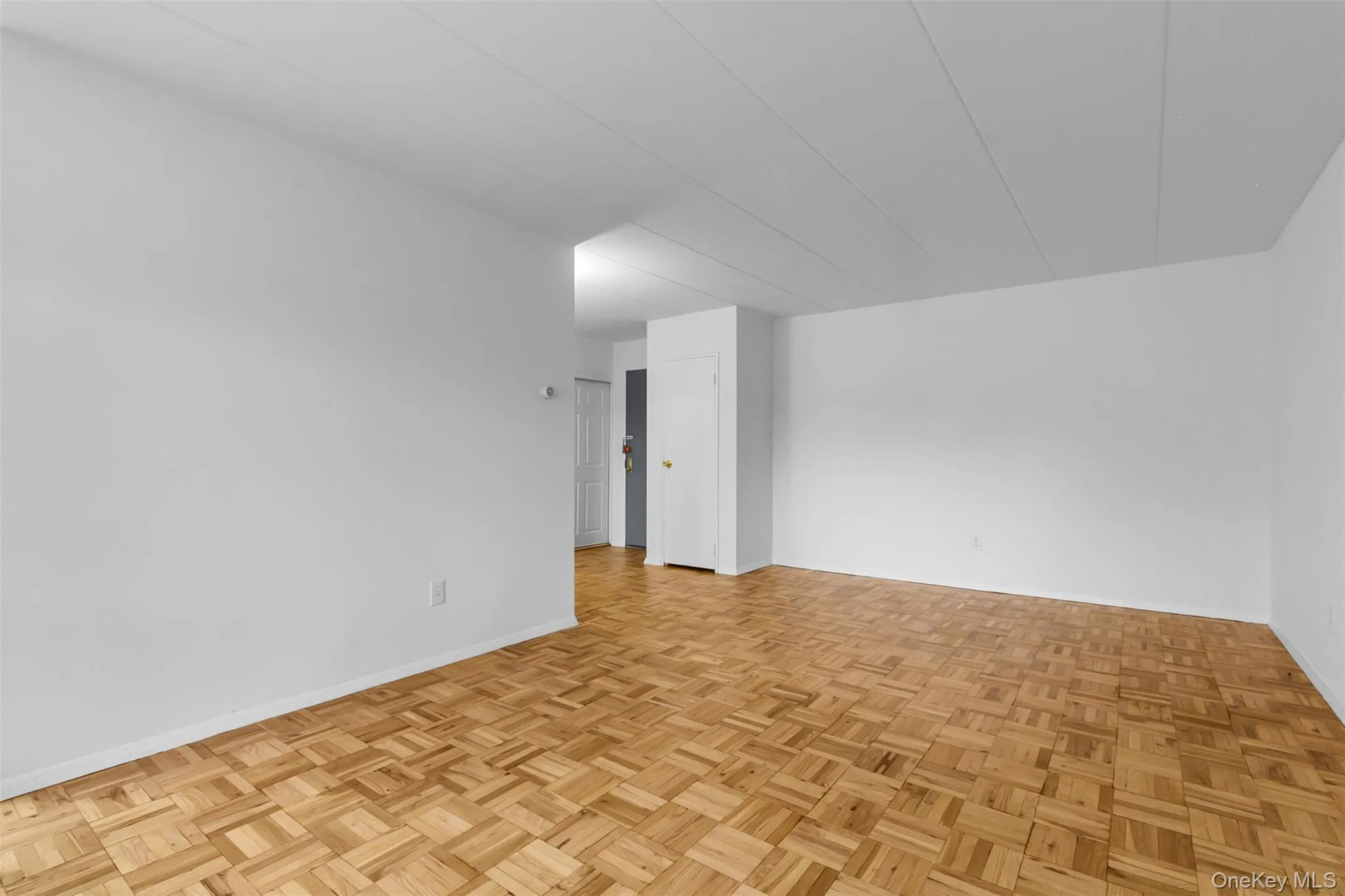 Unfurnished room with baseboards Unfurnished room with baseboards