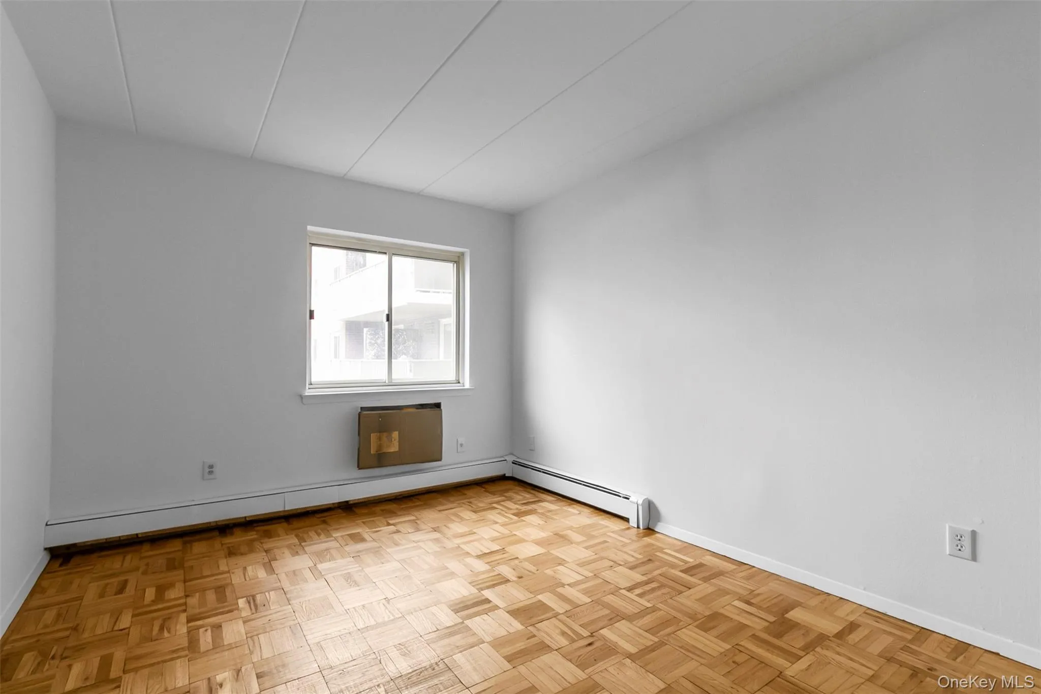Spare room featuring a baseboard heating unit and baseboard heating Spare room featuring a baseboard heating unit and baseboard heating