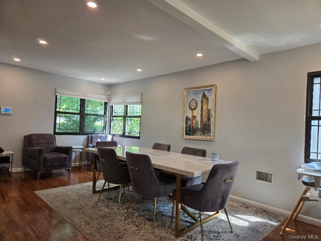 Dining room with recessed lighting, dark wood-style floors, and beamed ceiling Dining room with recessed lighting, dark wood-style floors, and beamed ceiling