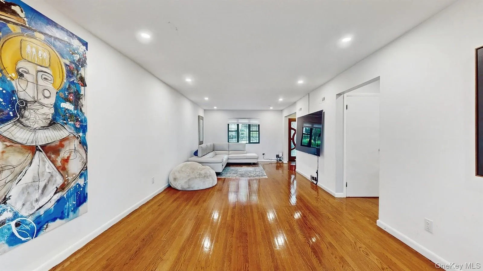 Living room with hardwood / wood-floors and lots of recessed lighting. View of the Sliding Glass Doors to the Balcony overlooking the spacious yard and un-obstructed Hudson River View! Living room with hardwood / wood-floors and lots of recessed lighting. View of the Sliding Glass Doors to the Balcony overlooking the spacious yard and un-obstructed Hudson River View!