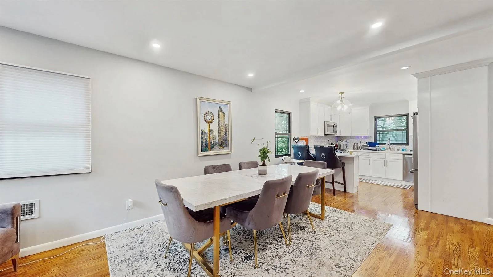 Dining room featuring light wood finished floors and recessed lighting Dining room featuring light wood finished floors and recessed lighting