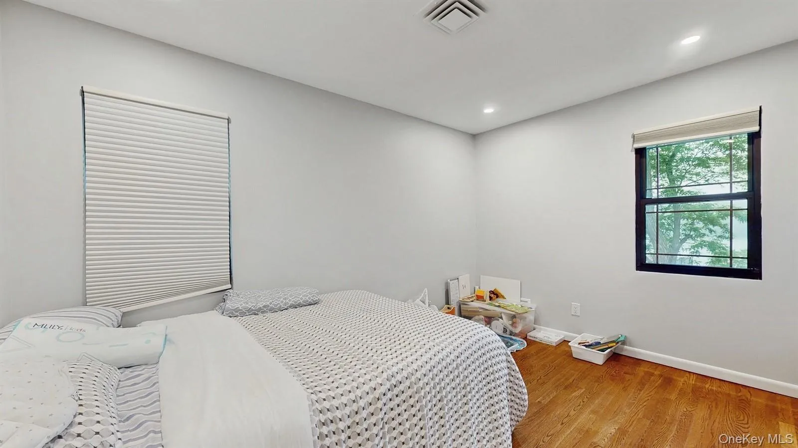 Bedroom featuring light Hardwood flooring and recessed lighting Bedroom featuring light Hardwood flooring and recessed lighting